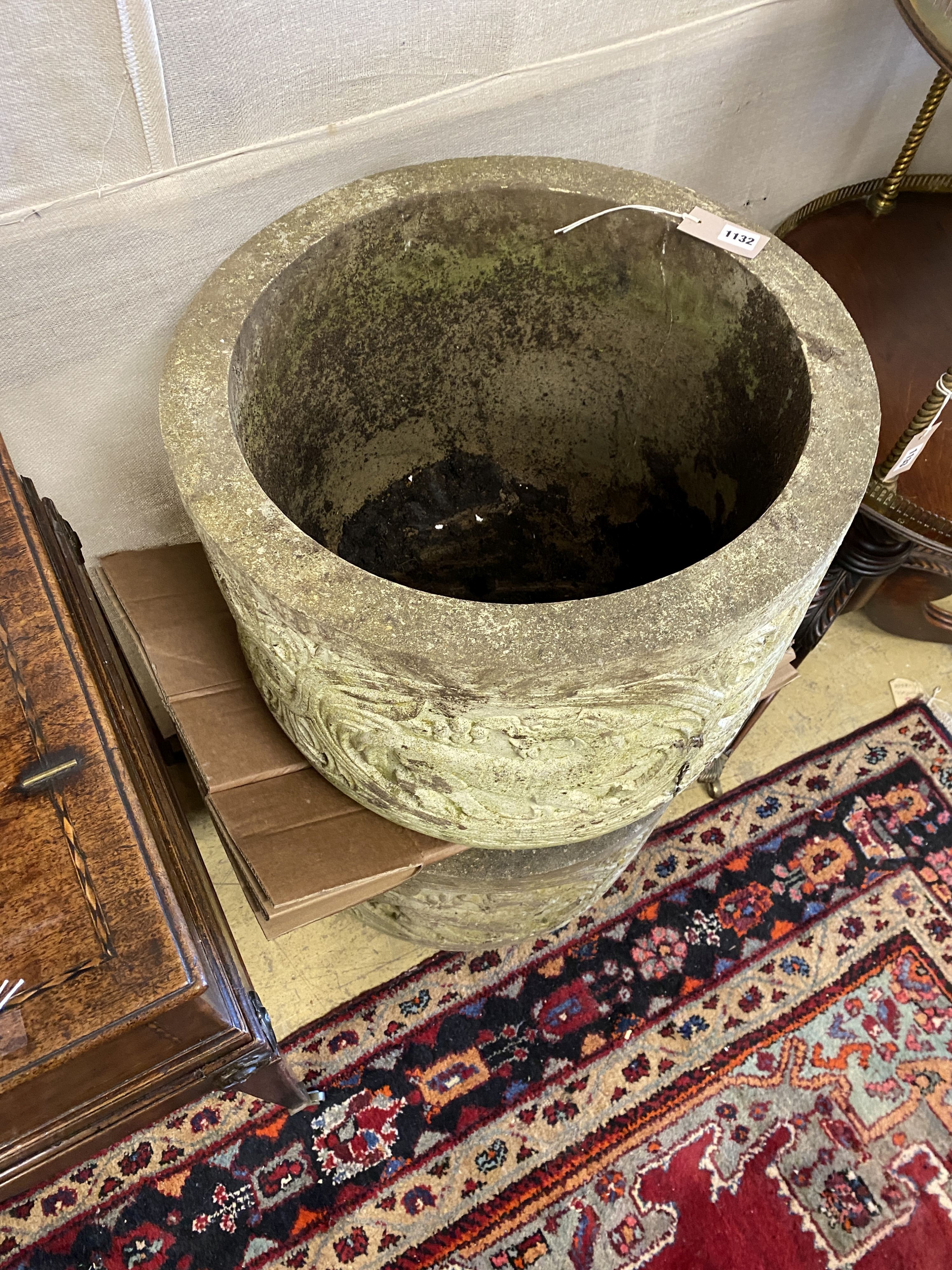 A pair of reconstituted stone circular garden planters, diameter 54cm, height 42cm